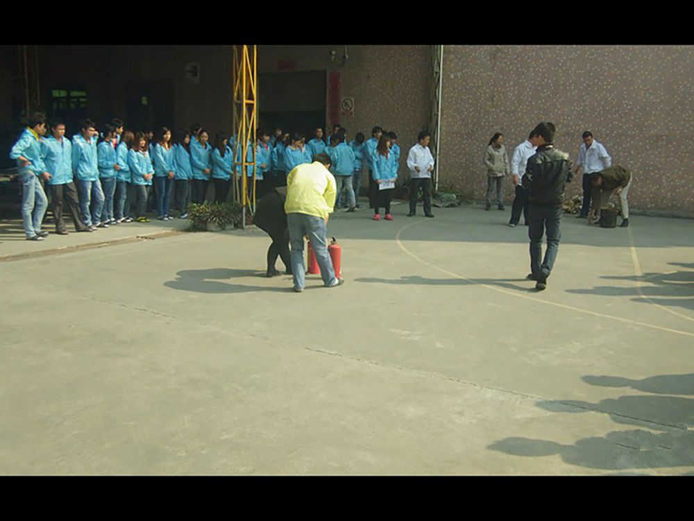 Staff fire safety training exercise at Aglare Lighting